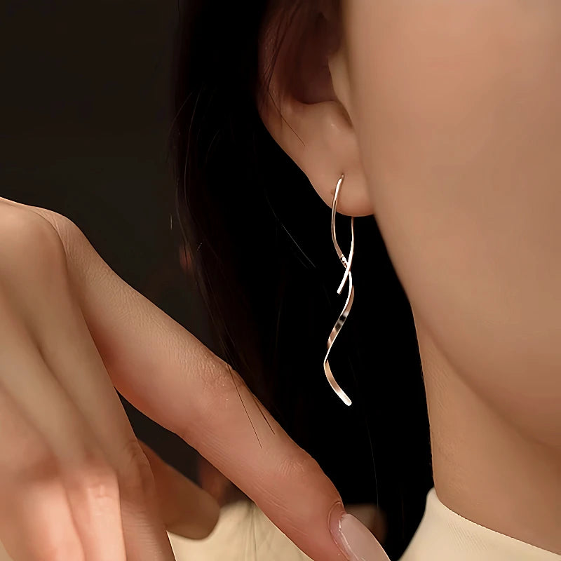 Close-up detail of the sparkling zircons and plating on the Wavy Threader Earrings