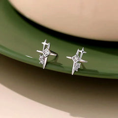 Model showcasing the dangle and style of the Sterling Silver Zircon Bling Star Stud Earrings