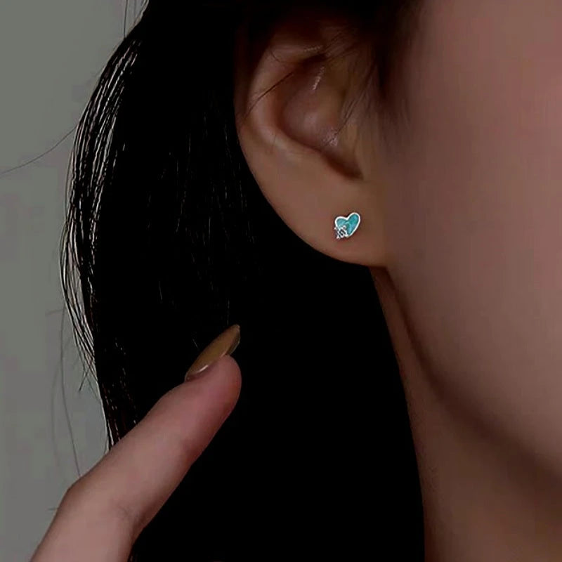 Close-up detail of the sparkling zircons and plating on the Blue Heart Studs