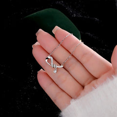 Close-up of the pendant and clasp on the Zircon Bow Necklace