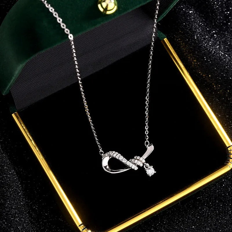 Detailed view of the Sterling Silver Zircon Bow Necklace chain and pendant