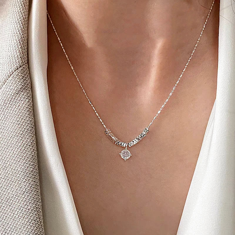 Sterling Silver Zircon Broken Silver Necklace worn to showcase its length and pendant detail