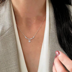 Detailed view of the Sterling Silver Zircon Broken Silver Necklace chain and pendant