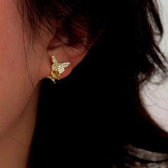 Model showcasing the dangle and style of the Sterling Silver Zircon Butterfly Stud Earrings
