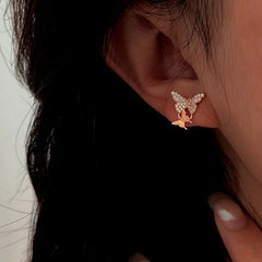 Close-up detail of the sparkling zircons and plating on the Butterfly Stud Earrings