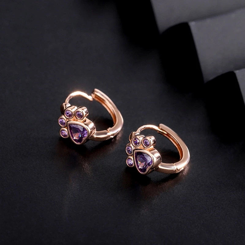 Close-up detail of the sparkling zircons and plating on the Pet Paw Hoops