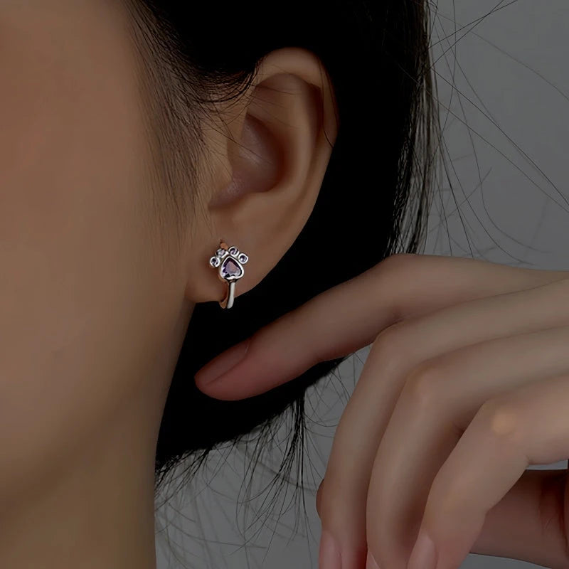 Angled view of the Sterling Silver Zircon Cute Pet Hoop Earrings