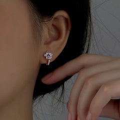 Angled view of the Sterling Silver Zircon Cute Pet Hoop Earrings