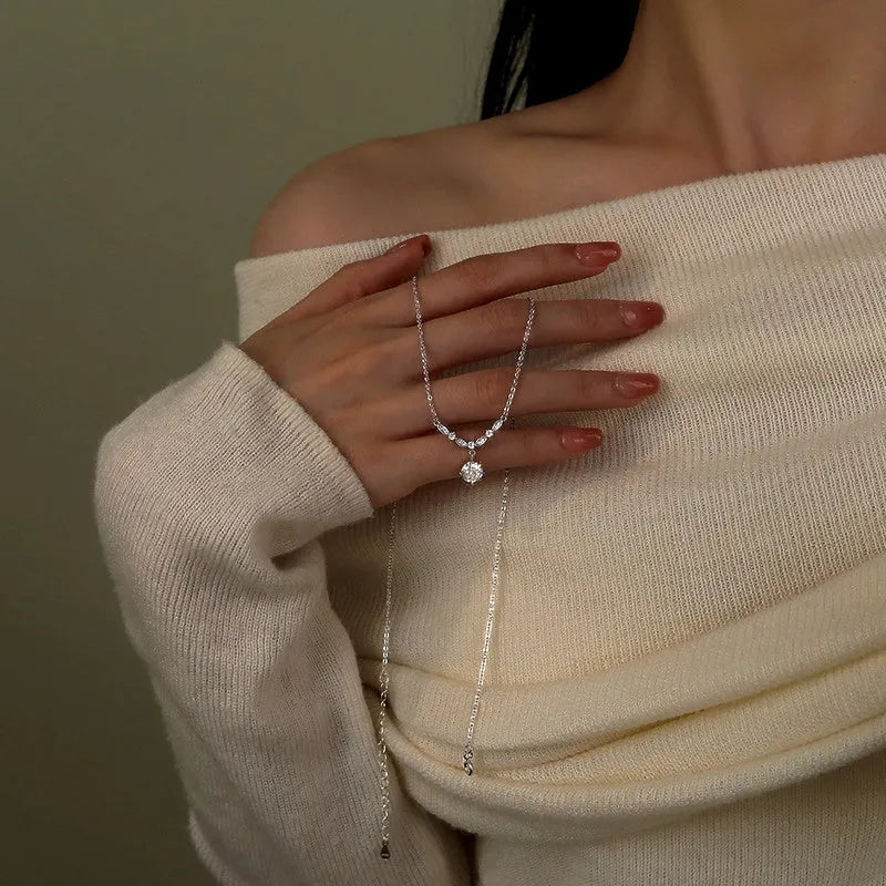 Close-up of the pendant and clasp on the Zircon Solitaire Necklace