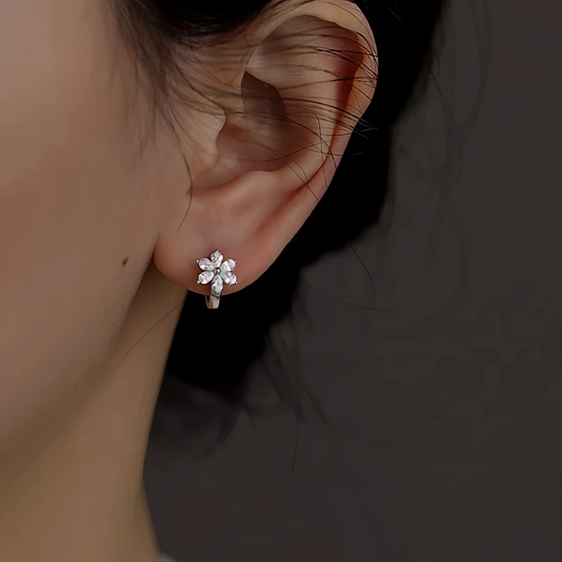 Close-up detail of the sparkling zircons and plating on the Flower Hoop Earrings