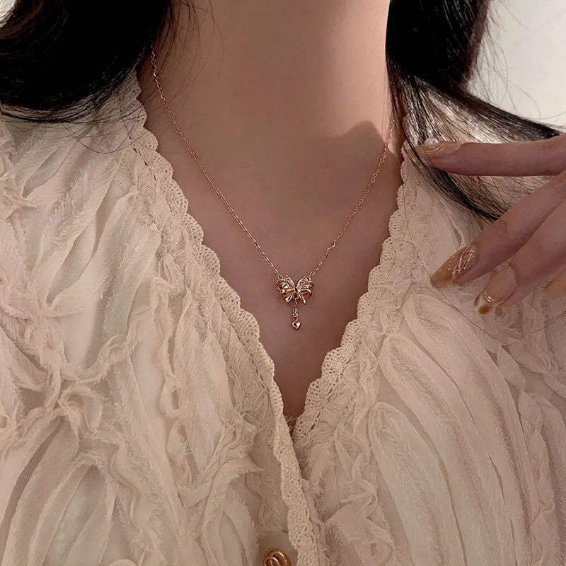 Sterling Silver Zircon Heart Bow Necklace worn to showcase its length and pendant detail