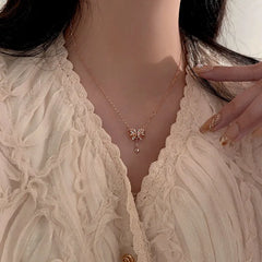 Sterling Silver Zircon Heart Bow Necklace worn to showcase its length and pendant detail