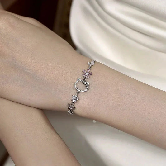 Model wearing the Sterling Silver Zircon Hello Kitty Bracelet to highlight its design on the wrist