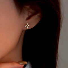 Model showcasing the dangle and style of the Sterling Silver Zircon Hollow Four-Cornered Star Stud Earrings