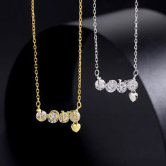 Sterling Silver Zircon Letter LOVE Necklaces worn to showcase its length and pendant detail