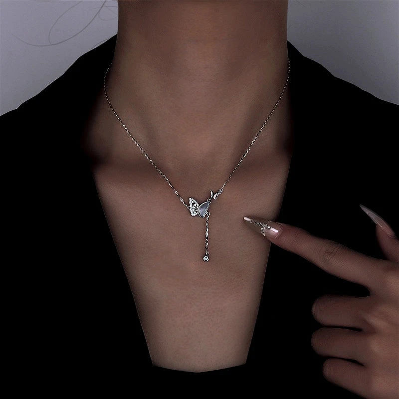 Close-up of the pendant and clasp on the Mother Butterfly Necklace