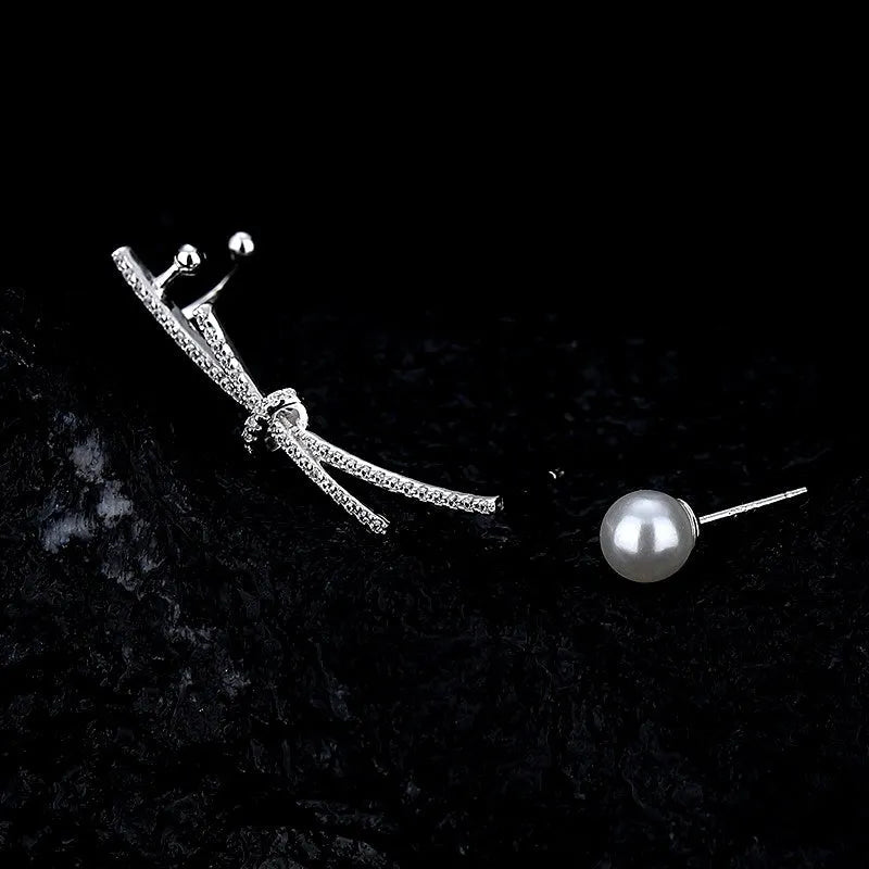 Close-up detail of the sparkling zircons and plating on the Asymmetrical Pearl Earrings