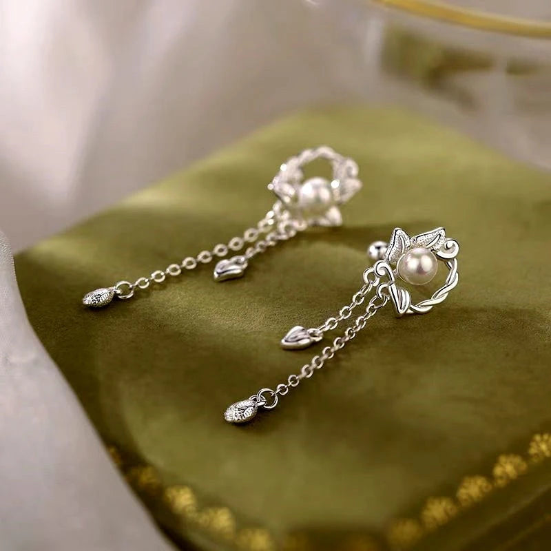 Angled view of the Sterling Silver Zircon Pearl Tassel Earrings