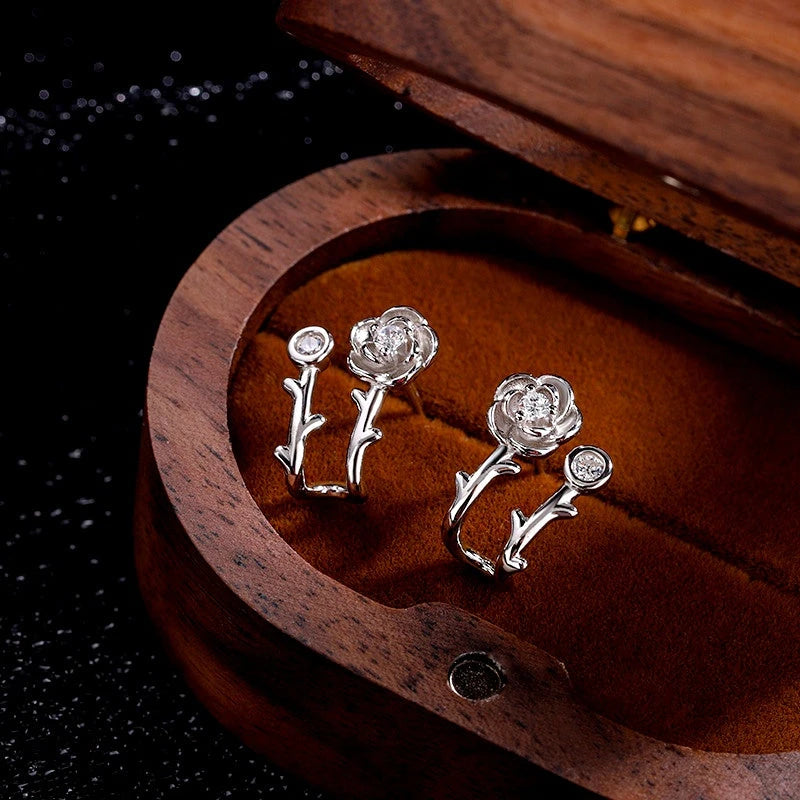 Model showcasing the dangle and style of the Sterling Silver Zircon Rose Stud Earrings