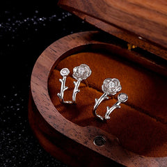 Model showcasing the dangle and style of the Sterling Silver Zircon Rose Stud Earrings
