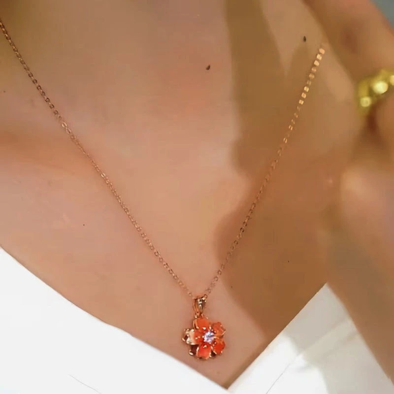 Close-up of the pendant and clasp on the Rotating Blossom Necklace