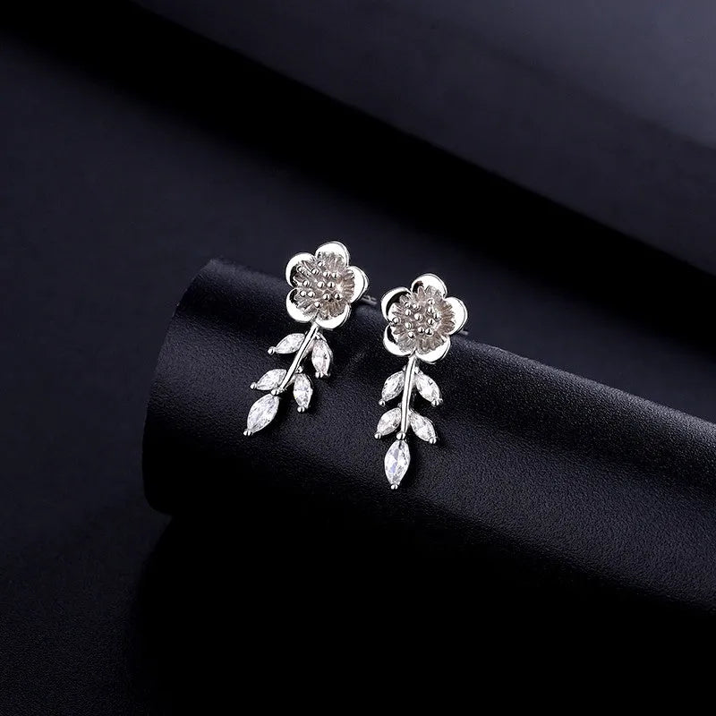 Close-up detail of the sparkling zircons and plating on the Zircon Flower Earrings
