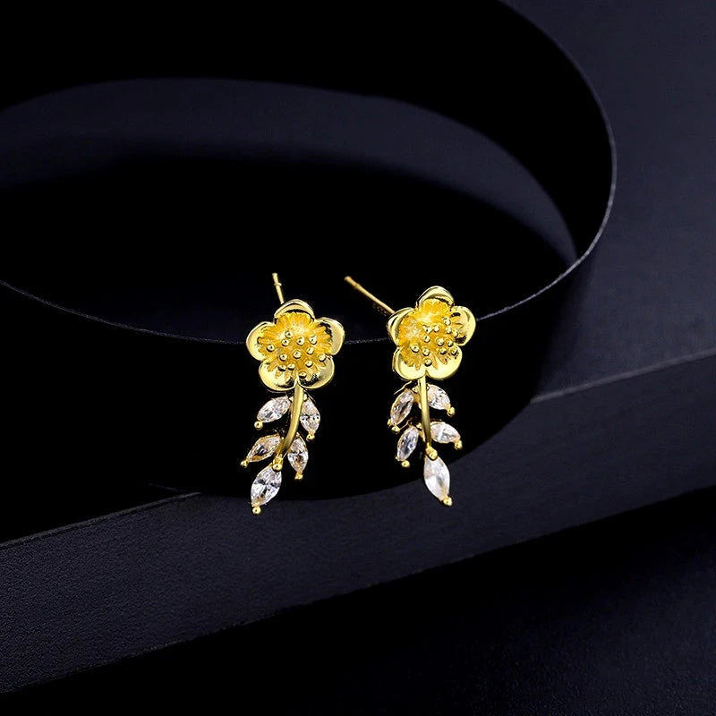 Angled view of the Sterling Silver Zircon Small Fragrance Style Flower Earrings