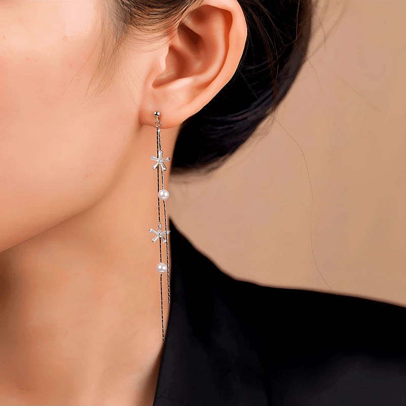 Close-up detail of the sparkling zircons and plating on the Star Pearl Earrings