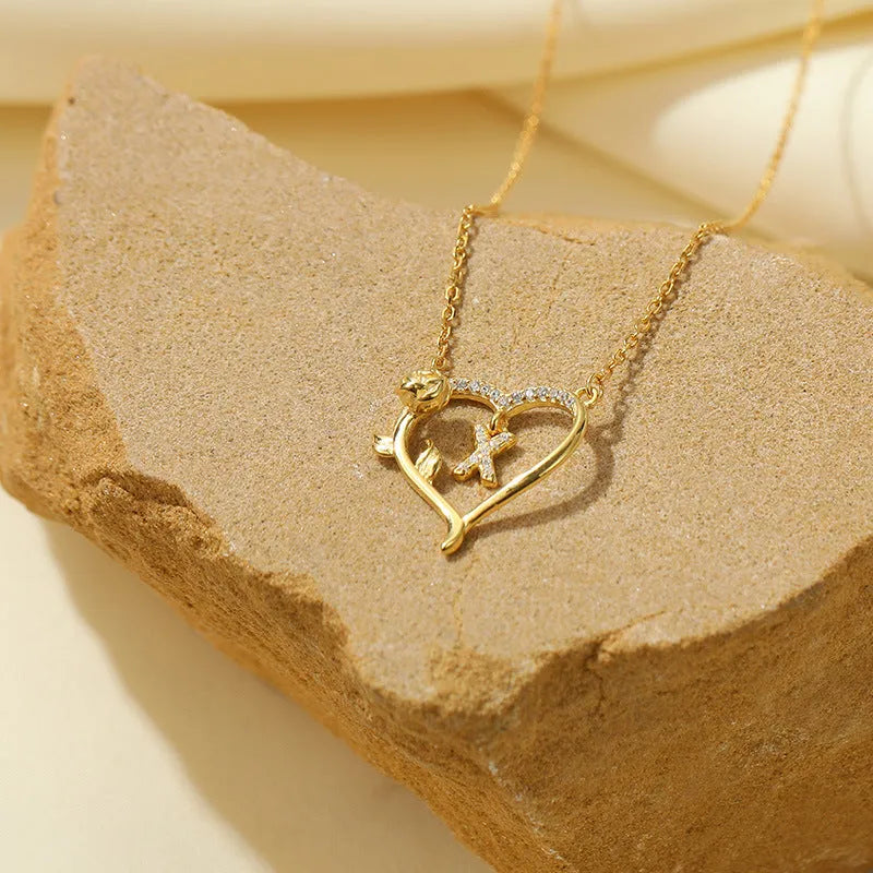 Detailed view of the Sterling Silver Heart Rose Letter Necklaces chain and pendant