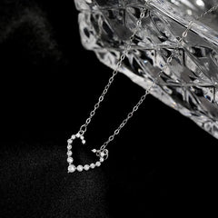 Close-up of the pendant and clasp on the Lucky Clover Necklace