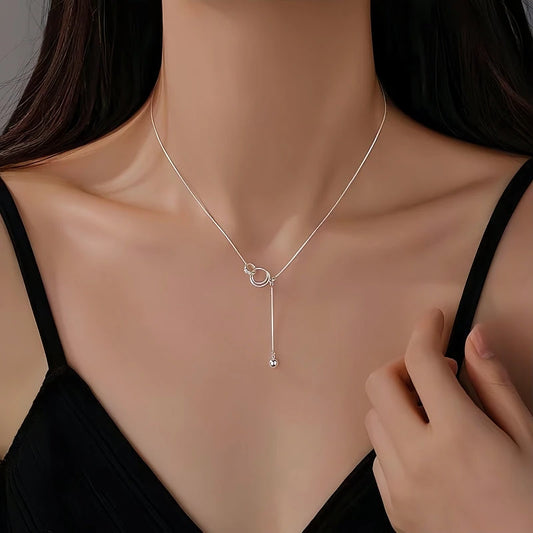 Sterling Silver Ring Necklace worn to showcase its length and pendant detail