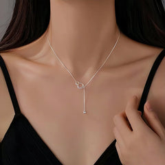 Sterling Silver Ring Necklace worn to showcase its length and pendant detail