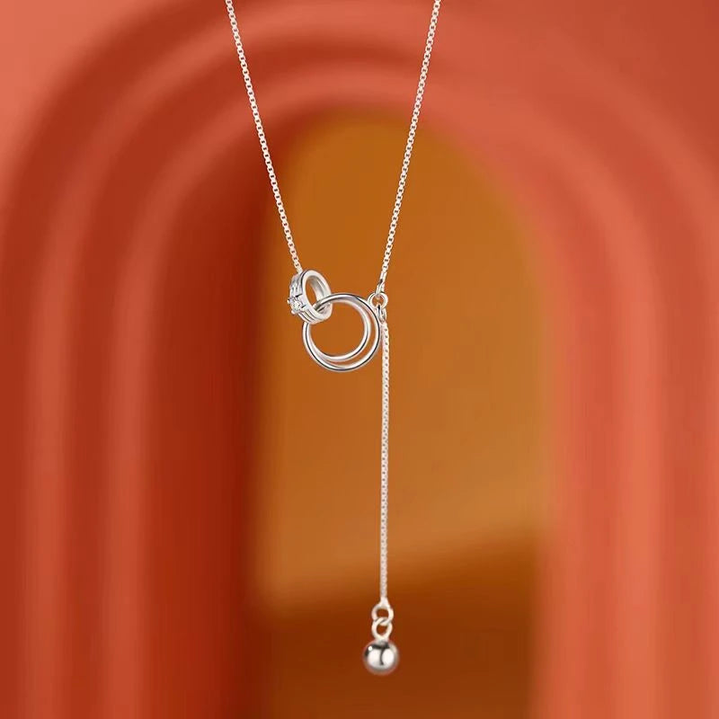 Detailed view of the Sterling Silver Ring Necklace chain and pendant
