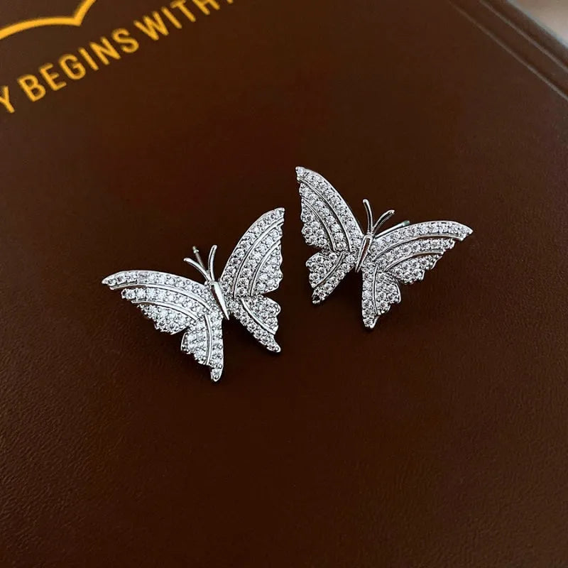 Close-up detail of the sparkling zircons and plating on the Butterfly Stud Earrings