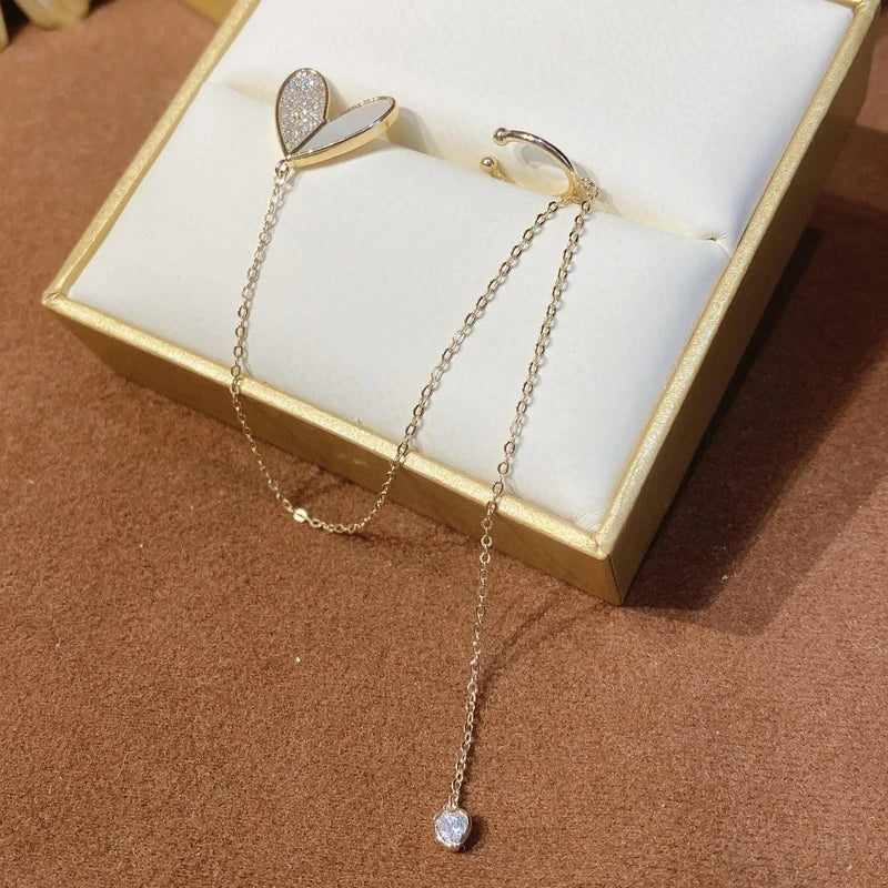 Model showcasing the dangle and style of the Heart Design Zircon Ear Cuffs (1 Pair)