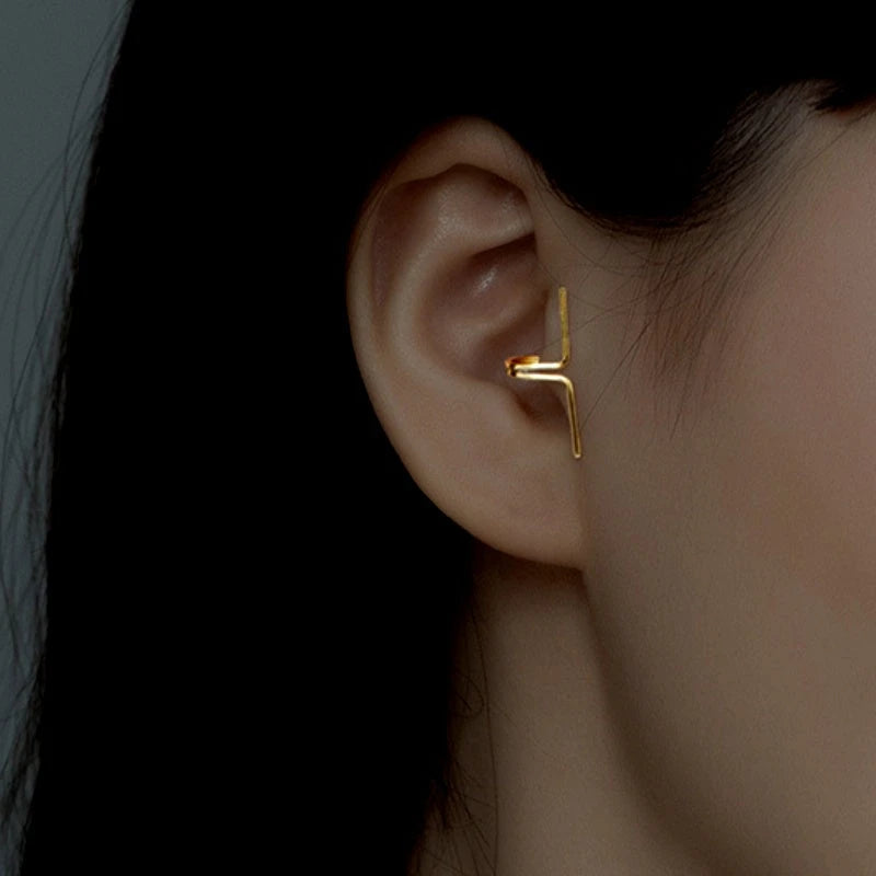 Model showcasing the dangle and style of the Sterling Silver Cross-Border Ear Clips ( 1 Pair )