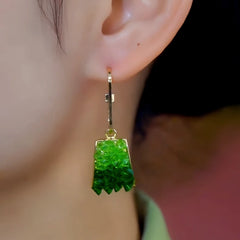 Model showcasing the dangle and style of the 14K Gold-Plated Elegant Zircon Crystal Earrings