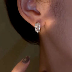 Angled view of the 14K Gold-Plated Elegant Zircon Pearl C-Shaped Earrings