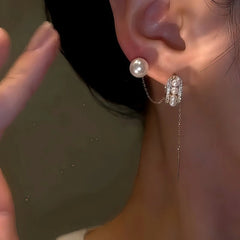 Model showcasing the dangle and style of the 14K Gold-Plated Elegant Zircon Pearl C-Shaped Earrings