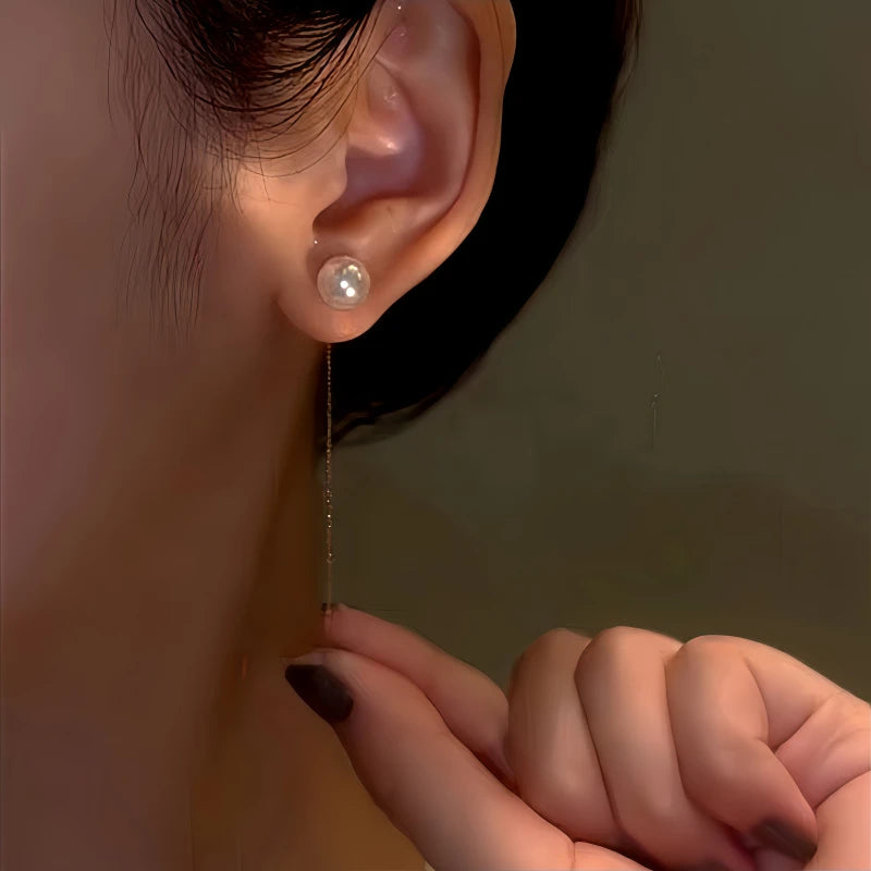 Close-up detail of the sparkling zircons and plating on the gold pearl earrings