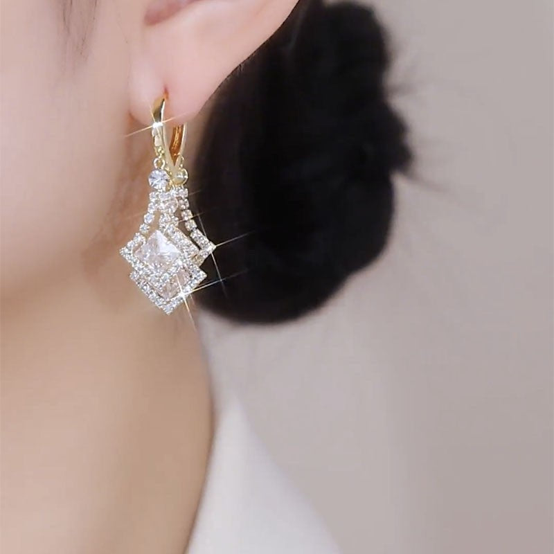 Gold Layered Square Cubic Zirconia Drop Earrings Worn on Ear