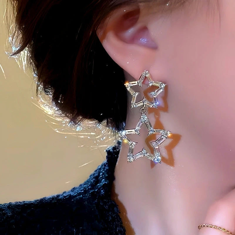Close-up detail of the sparkling zircons and plating on the Star Dangle Earrings