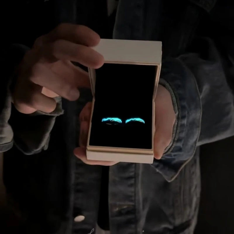 Close-up view of the gemstone and setting of the Luminous Couple Rings
