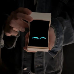 Close-up view of the gemstone and setting of the Luminous Couple Rings