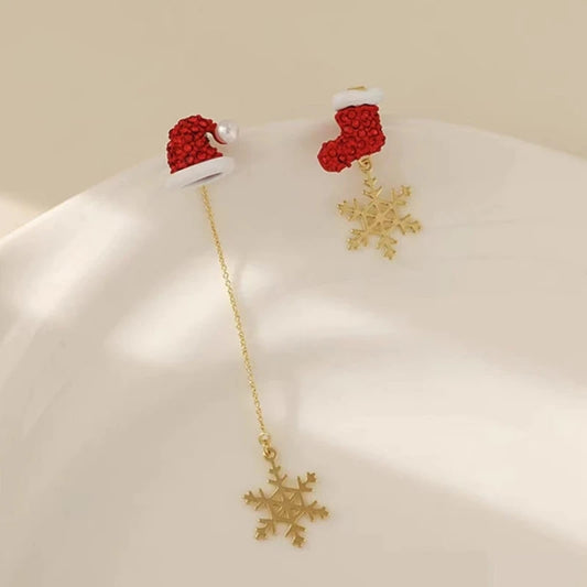 Model showcasing the dangle and style of the 14K Gold Plated Christmas Asymmetrical Snowflake Earrings