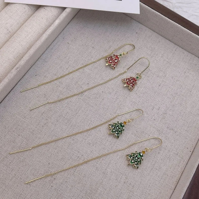 Model showcasing the dangle and style of the 14K Gold Plated Christmas Tree Threader Earrings