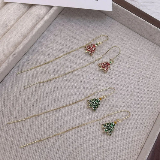 Model showcasing the dangle and style of the 14K Gold Plated Christmas Tree Threader Earrings
