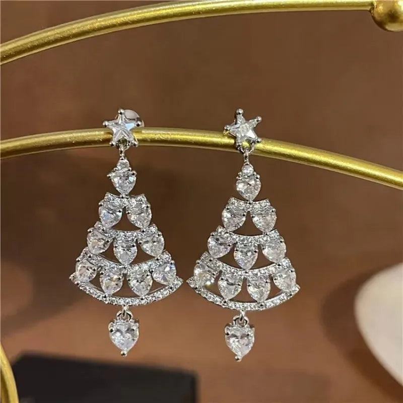 Model showcasing the dangle and style of the Zircon Christmas Tree Earrings
