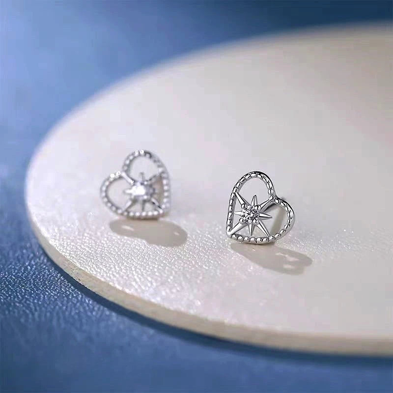 Angled view of the Sterling Silver Elegant Zircon Diamond Heart Studs