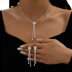 Sparkling silver rhinestone Y-necklace and drop earrings jewelry set on woman